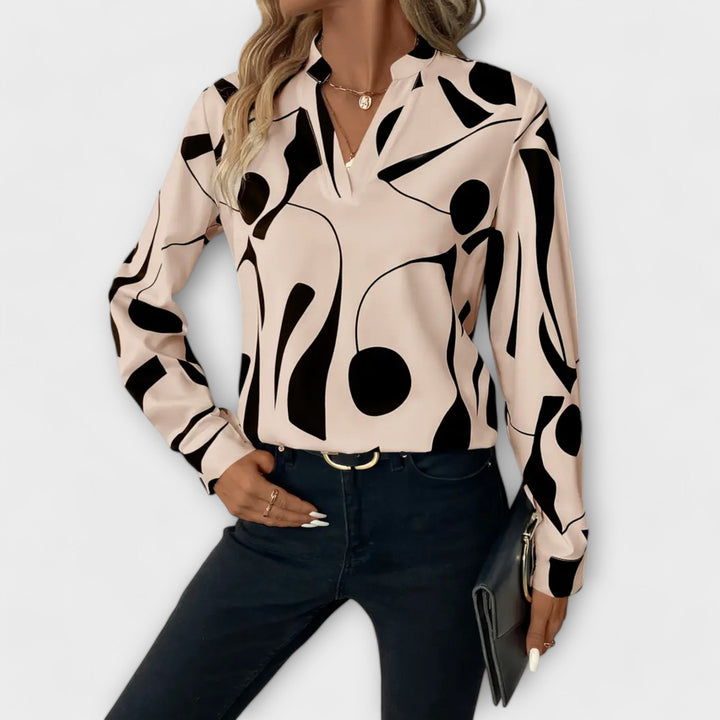 Blusa elegante de manga larga con escote en V